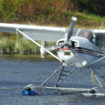 Ken Cote flying a C-GDIR, which is a Cessna A185F.